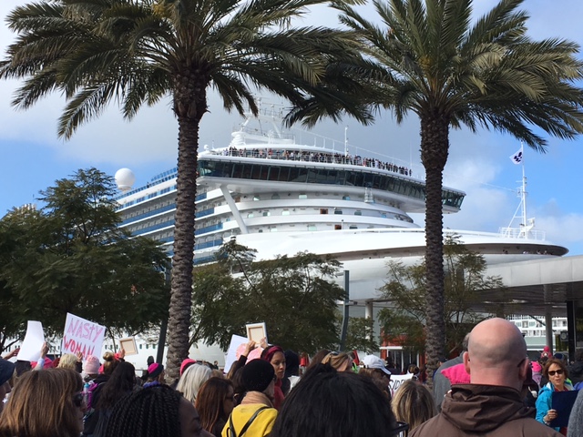 Travelers on a docked cruise ship watched and (some) cheered as we walked by. 